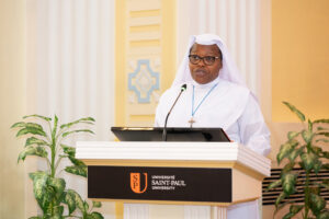 A religious sister speaks at the podium during the Saint Paul University convocation.