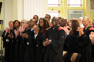 Graduates applaud during the Saint Paul University convocation ceremony.